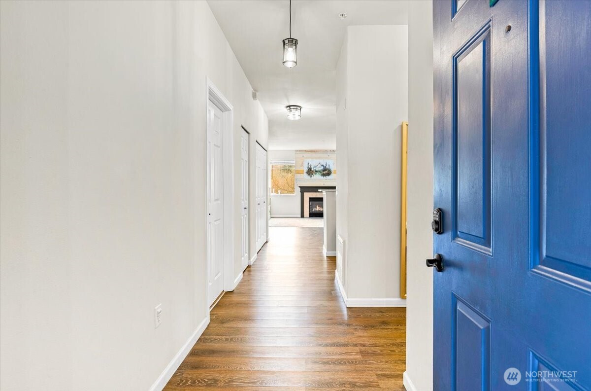 17426 Bothell Way Northeast, Unit A302 Bothell, WA 98011 - Photo 2 of 40 a view of a hallway with wooden floor