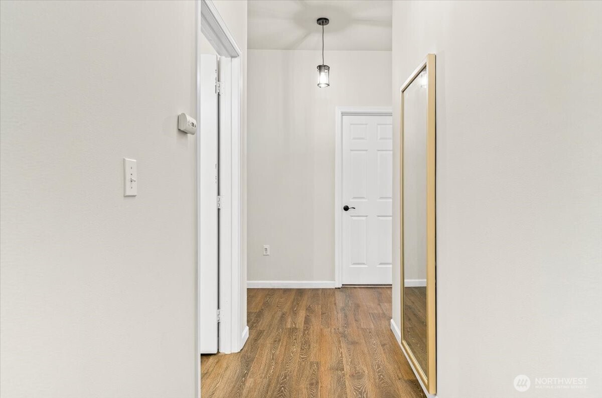 17426 Bothell Way Northeast, Unit A302 Bothell, WA 98011 - Photo 33 of 40 a view of a hallway with wooden floor