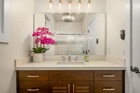 a bathroom with a sink and a mirror
