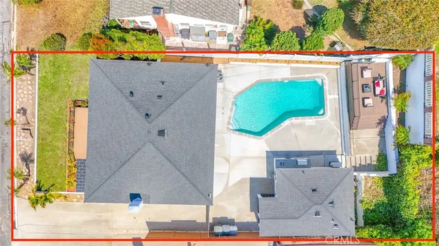 an aerial view of a house with a yard