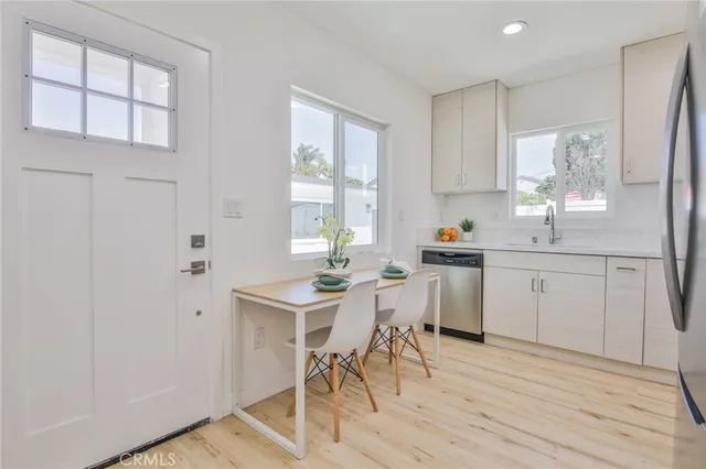 a kitchen with a sink cabinets and window