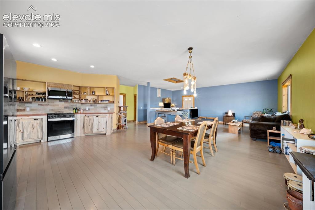 351 High Pasture Road Florissant, CO 80816 - Photo 9 of 39 Spacious dining area opens seamlessly to the kitchen.