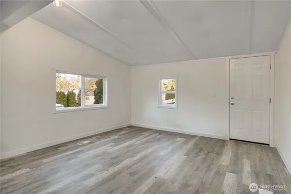 a view of an empty room with a window