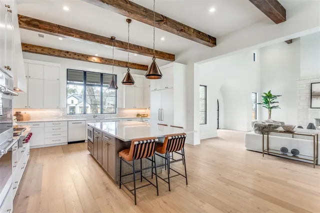 a very nice looking dining room with a large window