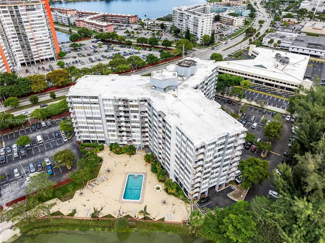 an aerial view of residential houses with yard