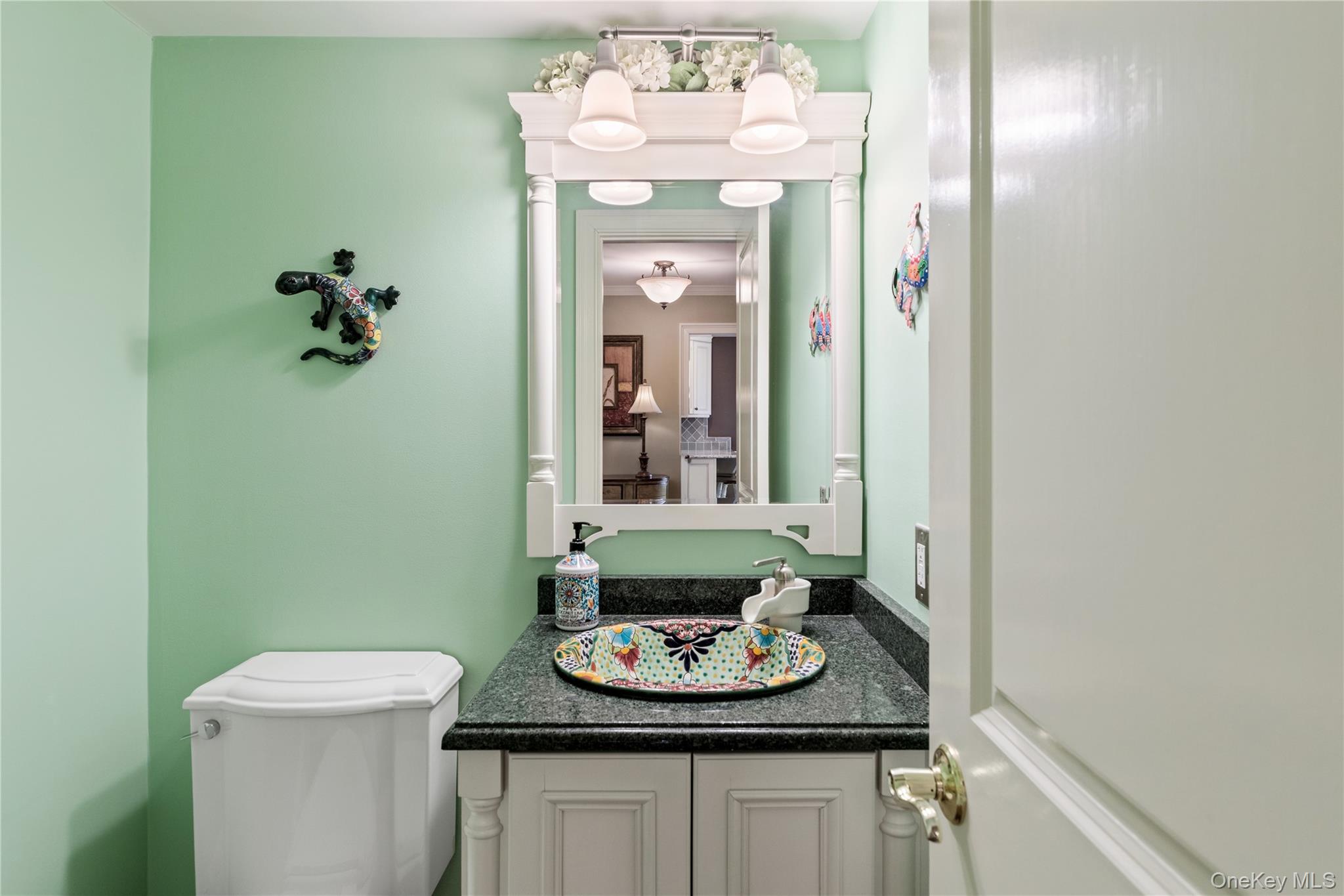 17 Sutton Place Islip, NY 11751 - Photo 18 of 32 Half bath featuring vanity and toilet
