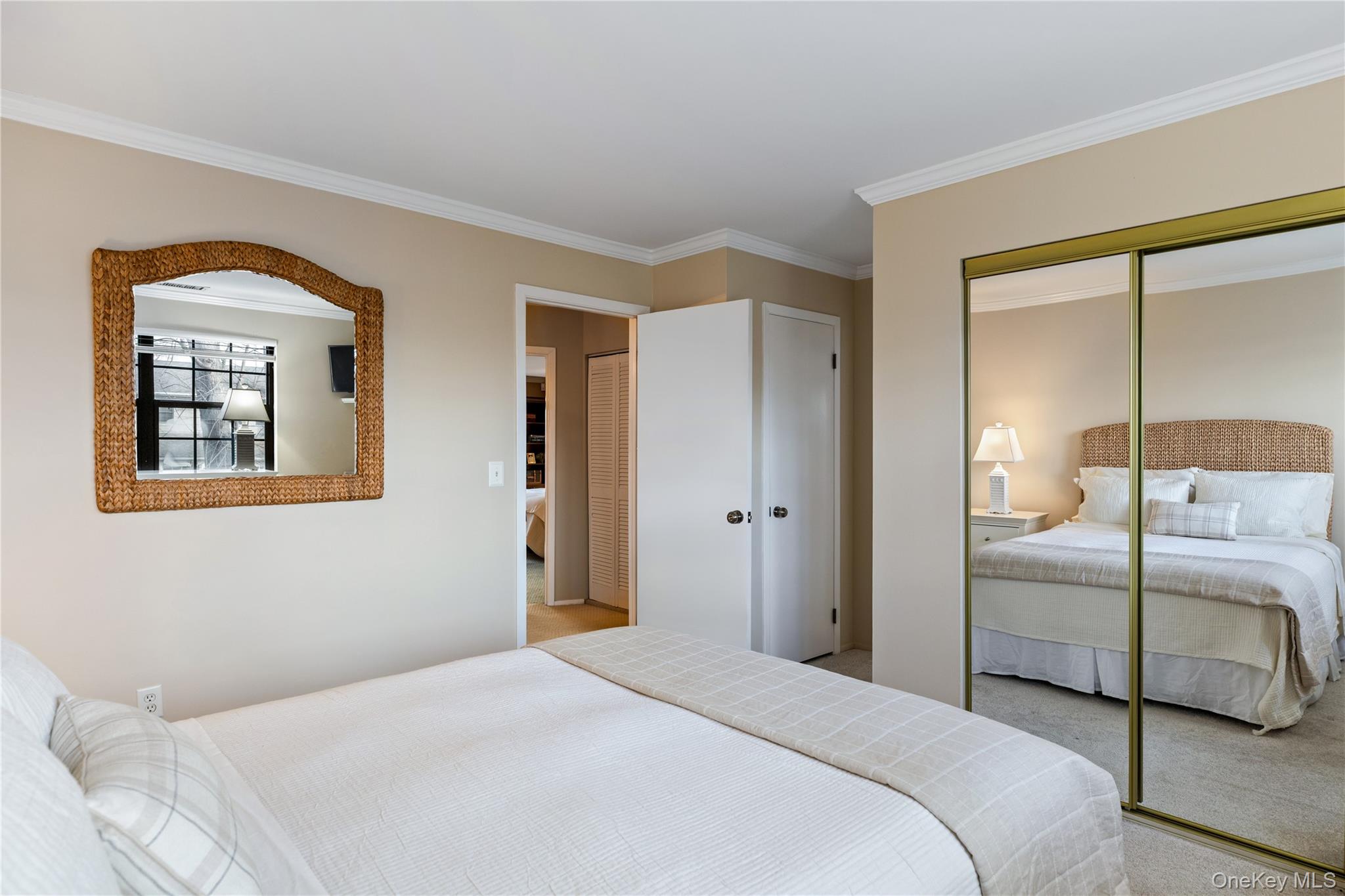 17 Sutton Place Islip, NY 11751 - Photo 25 of 32 Bedroom featuring crown molding, carpet floors, and a closet