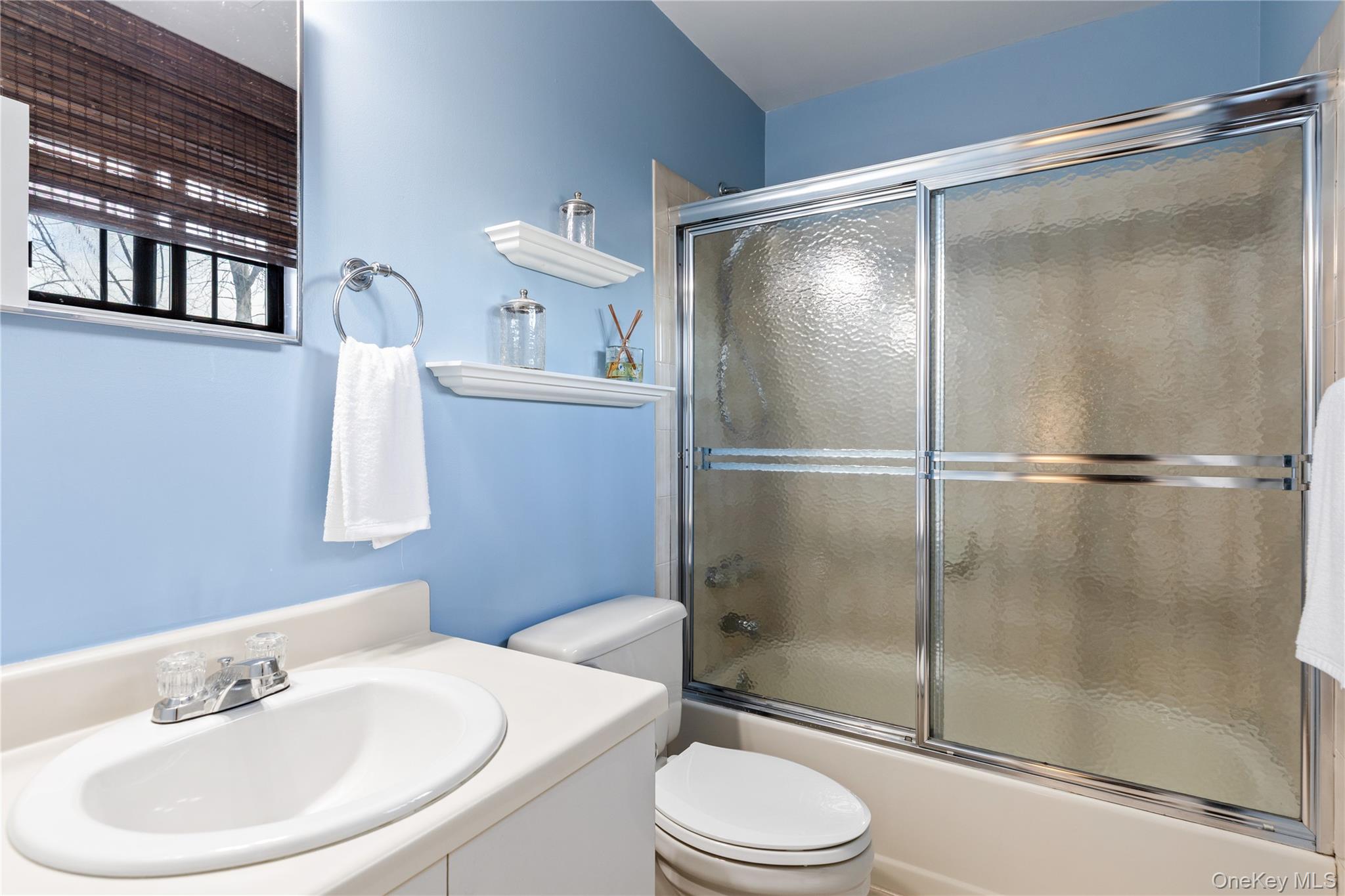 17 Sutton Place Islip, NY 11751 - Photo 26 of 32 Bathroom featuring vanity and enclosed tub / shower combo