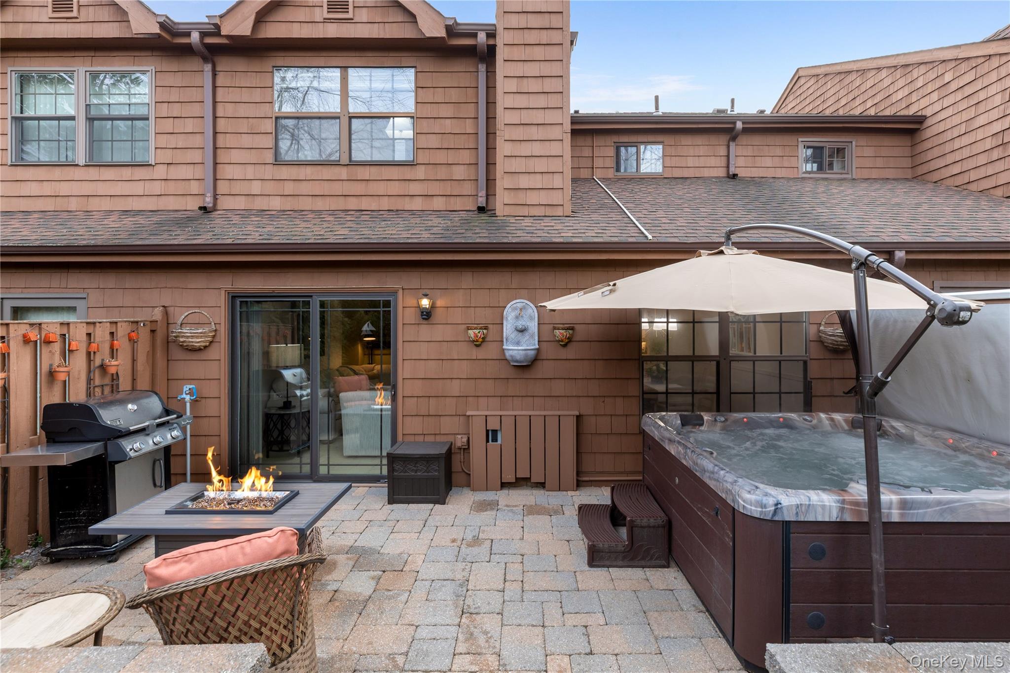 17 Sutton Place Islip, NY 11751 - Photo 27 of 32 View of patio with a hot tub, grilling area, and a fire pit