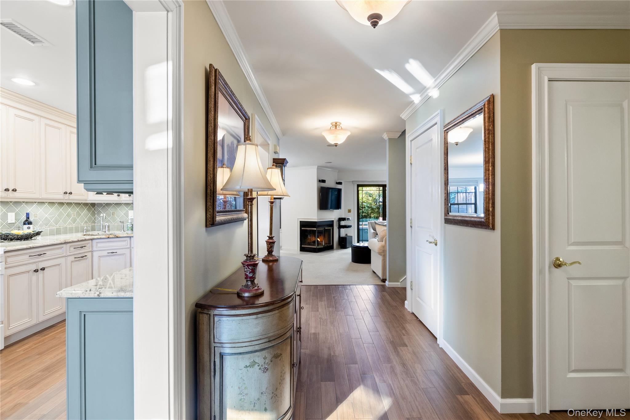 17 Sutton Place Islip, NY 11751 - Photo 3 of 32 Corridor featuring crown molding and light wood-style flooring