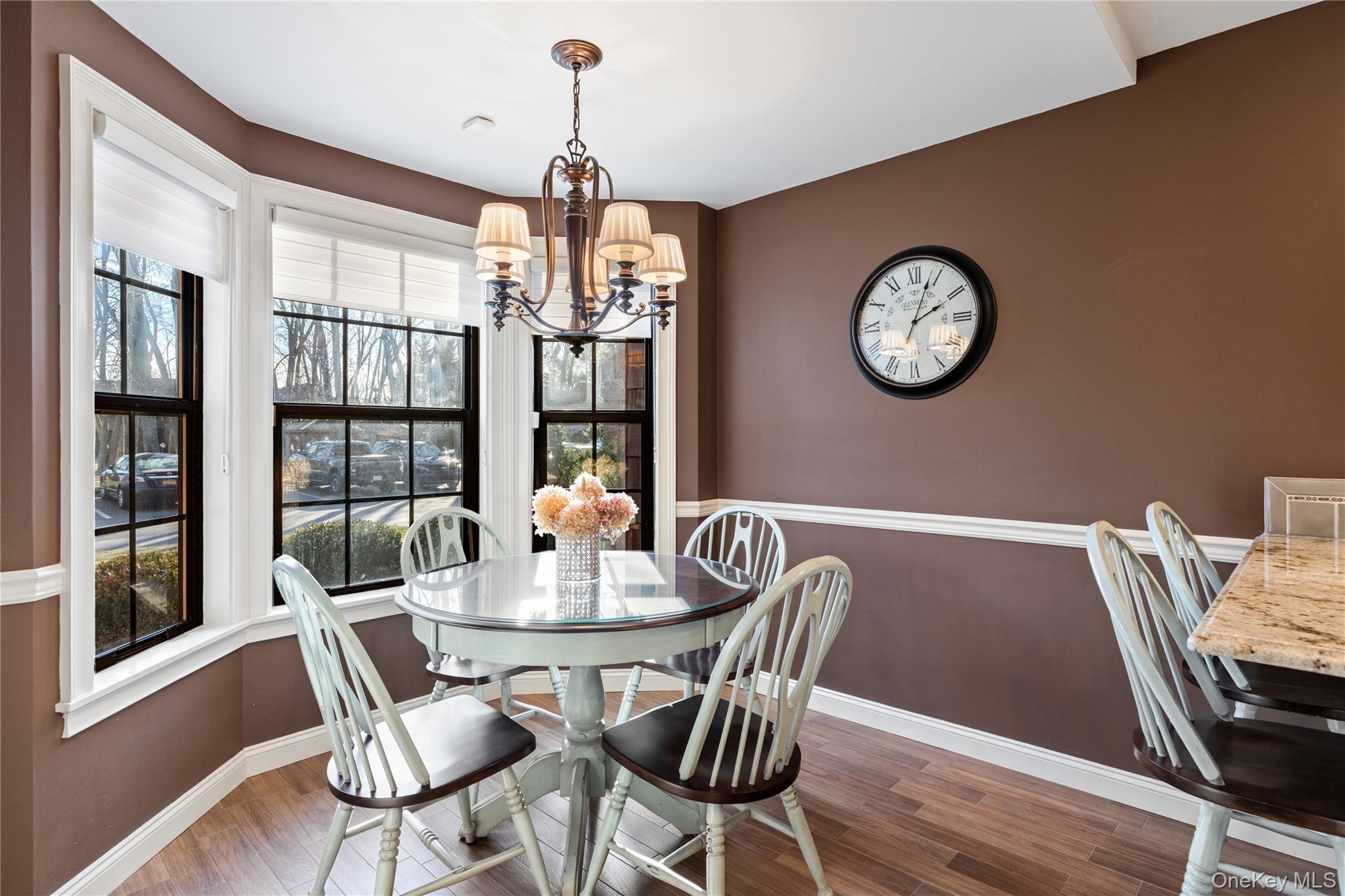 17 Sutton Place Islip, NY 11751 - Photo 4 of 32 Dining room with a chandelier and dark wood-style flooring