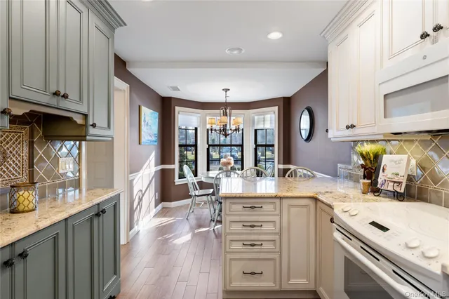 a kitchen with a stove a sink and a refrigerator