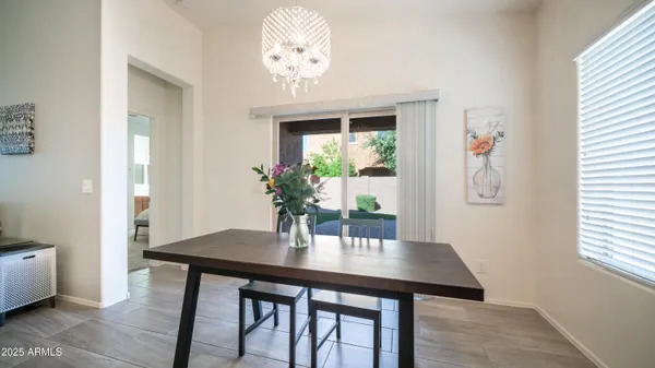 a view of a livingroom with furniture and a flat screen tv