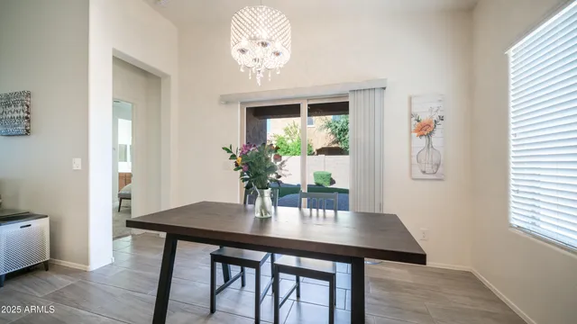 a view of a livingroom with furniture and a flat screen tv
