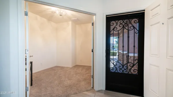 a bed room with a bed and a chandelier