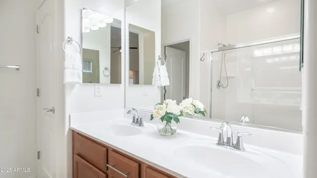a white toilet sitting next to a white sink