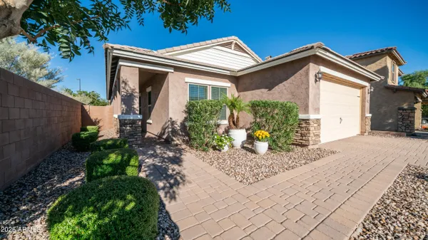 a front view of a house with garden