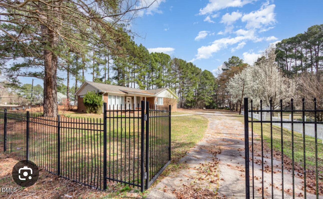 a view of a wrought iron fences in front of house