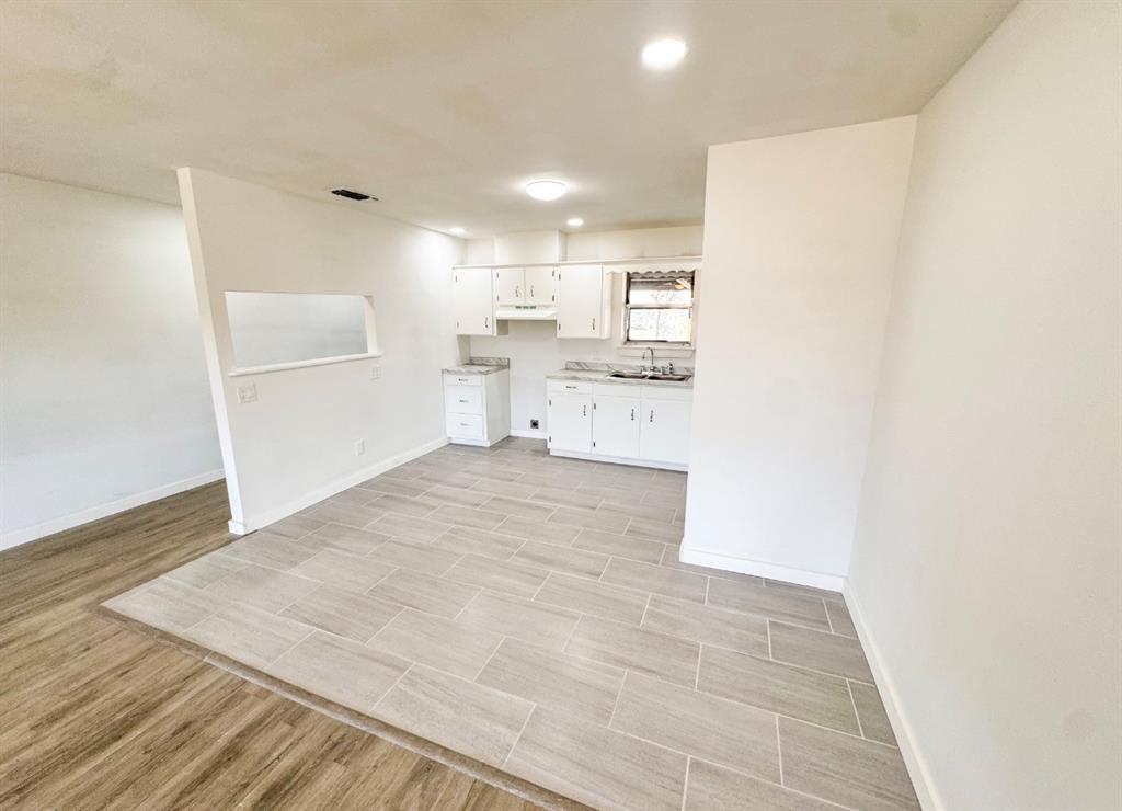 119 Autumn Drive Early, TX 76802 - Photo 14 of 29 a view of a kitchen with a sink and cabinets