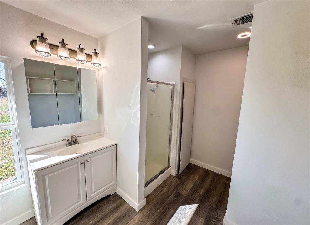 119 Autumn Drive Early, TX 76802 - Photo 19 of 29 a bathroom with a sink and mirror
