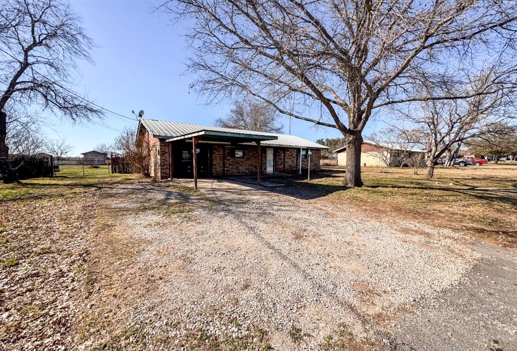 119 Autumn Drive Early, TX 76802 - Photo 2 of 29 a view of a yard with a large tree