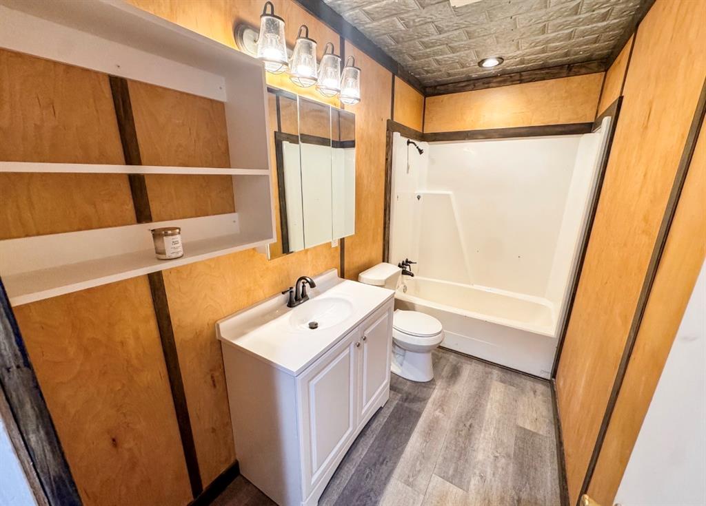 119 Autumn Drive Early, TX 76802 - Photo 22 of 29 a bathroom with a sink a toilet and shower