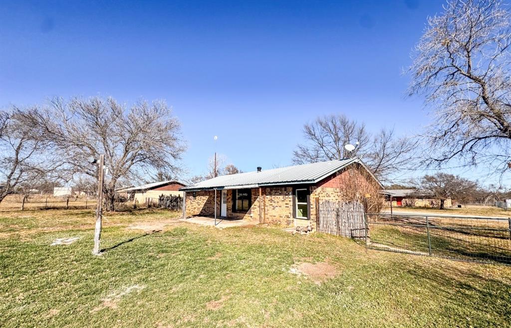 119 Autumn Drive Early, TX 76802 - Photo 26 of 29 a front view of a house with a yard