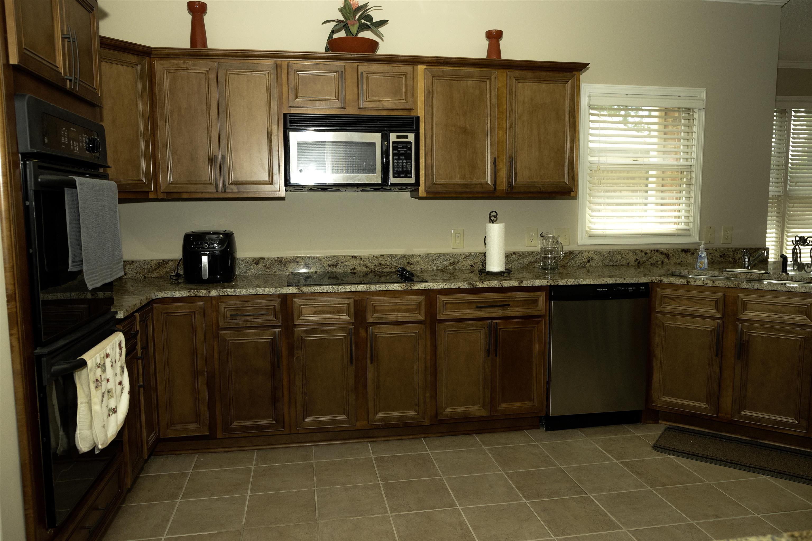 10420 Pilot Rock Road Collierville, TN 38017 - Photo 11 of 27 Full view of Kitchen with all new stainless steel appliances, new tile floors, new cabinets, new hardware, new granite countertops, new sink