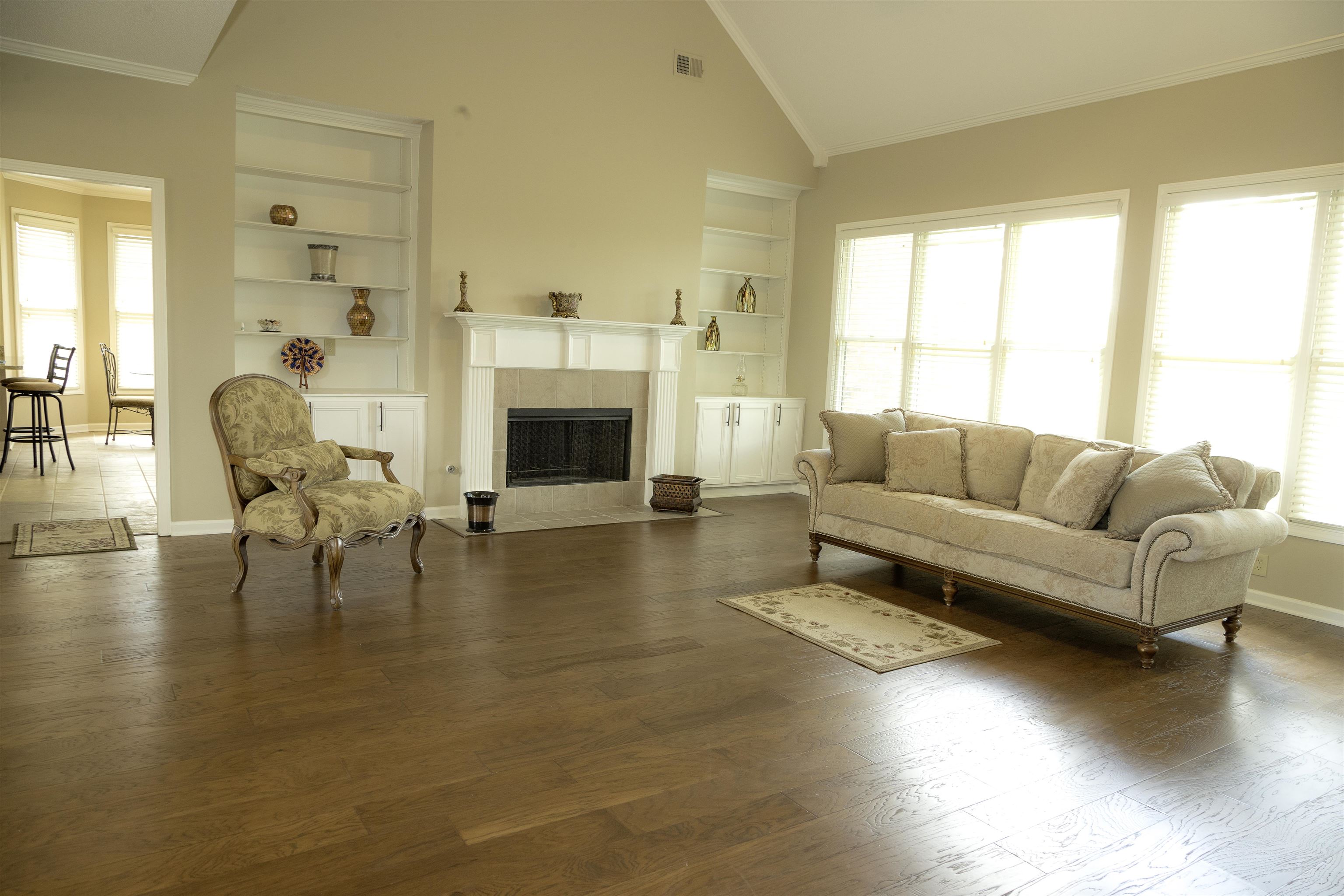 10420 Pilot Rock Road Collierville, TN 38017 - Photo 3 of 27 Large open living room with fireplace and beautiful new hardwood floors