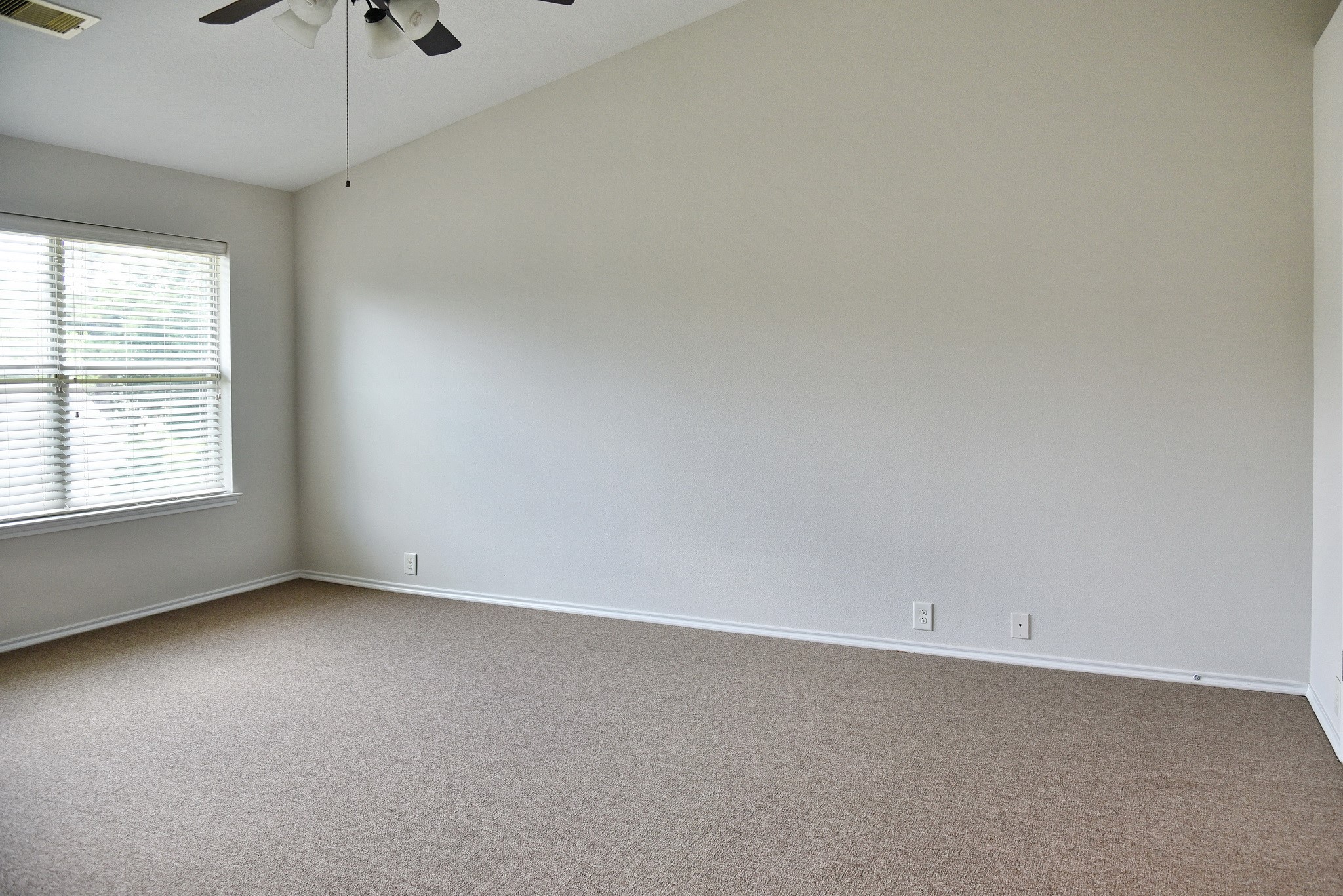 13600 Breton Ridge Street, Unit 20B Houston, TX 77070 - Photo 22 of 32 a view of an empty room with a window