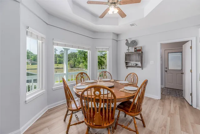 a view of a dining room with furniture window and outside view