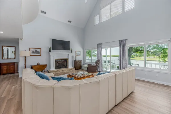 a living room with furniture fireplace and flat screen tv