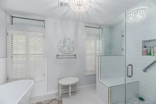 a bathroom with a toilet sink and shower
