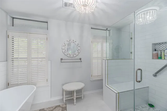 a bathroom with a toilet sink and shower