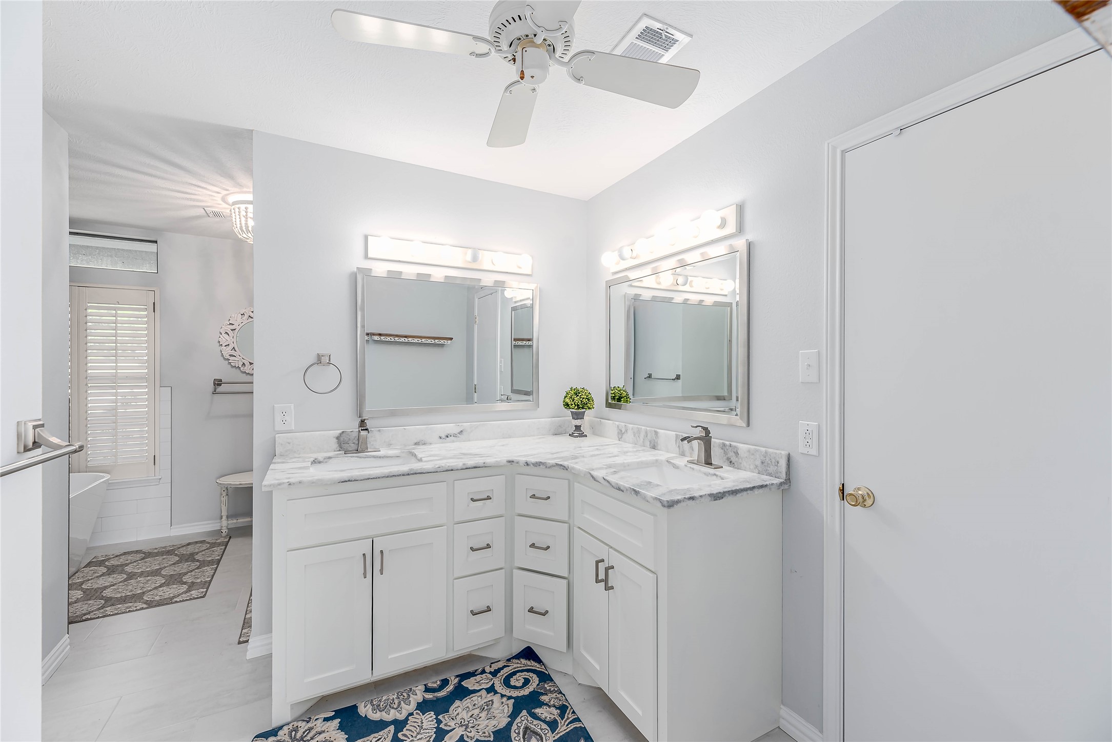 331 Memphis Belle Trinity, TX 75862 - Photo 18 of 50 a spacious bathroom with a shower sink and mirror