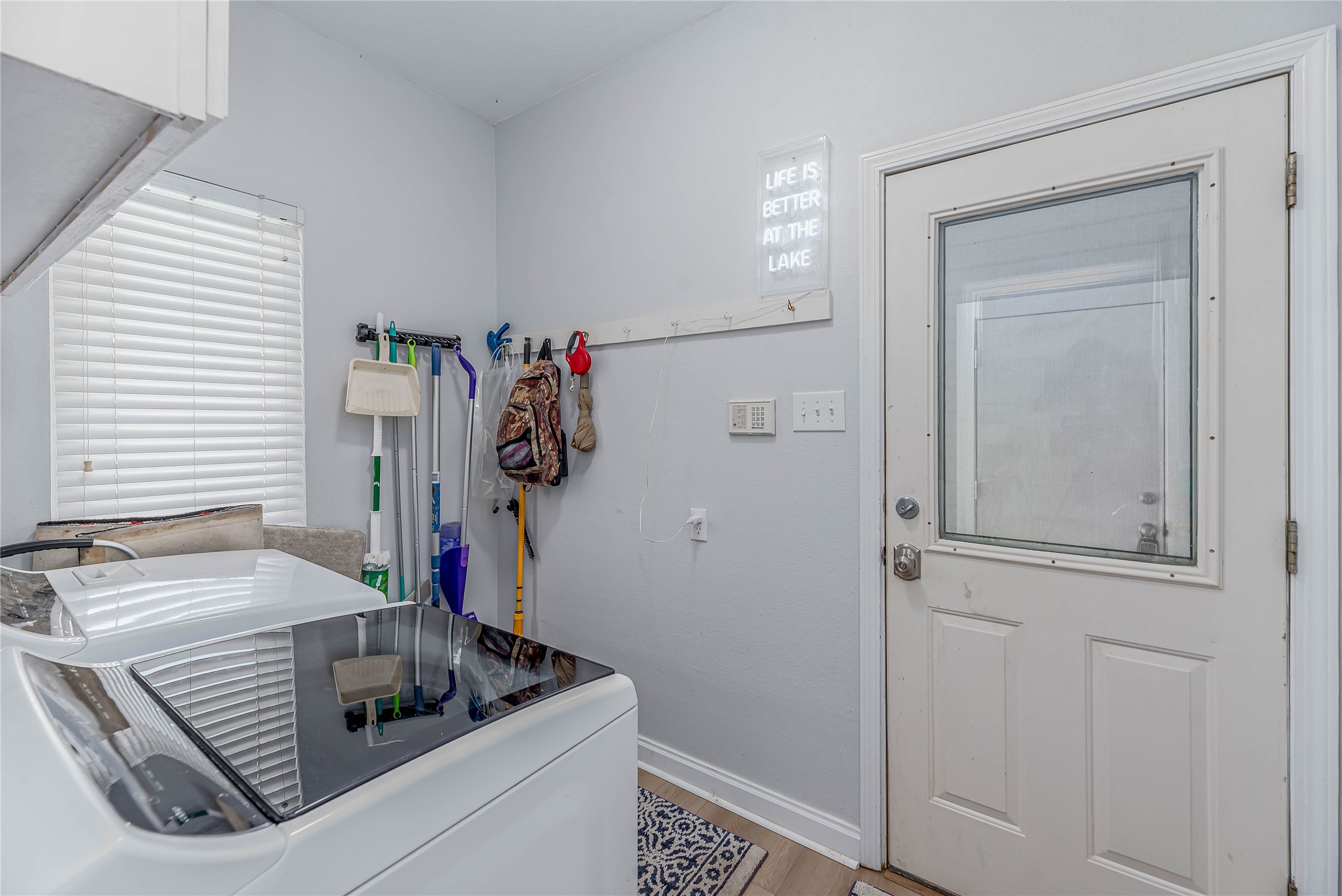 331 Memphis Belle Trinity, TX 75862 - Photo 25 of 50 a kitchen with a refrigerator and white cabinets
