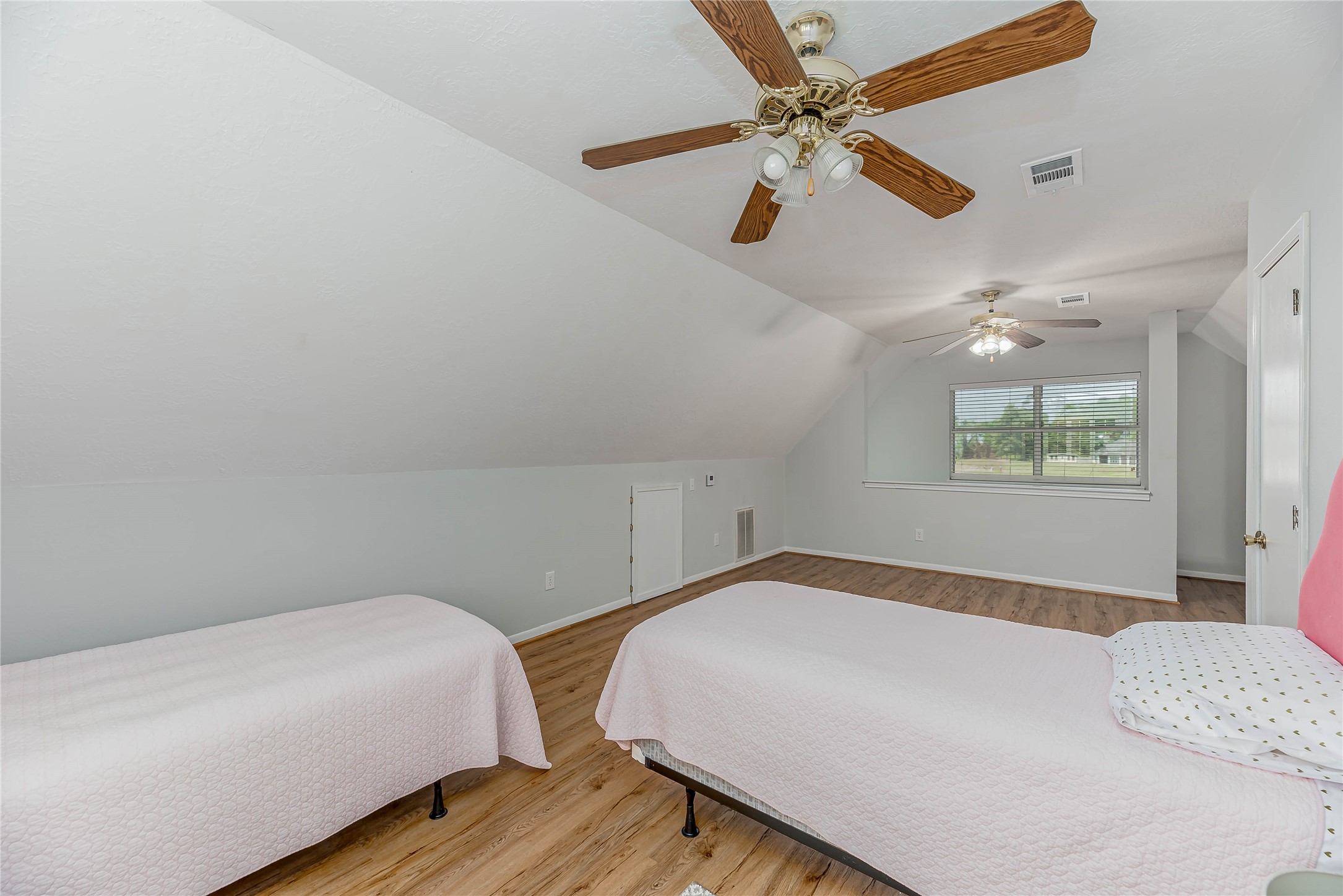 331 Memphis Belle Trinity, TX 75862 - Photo 28 of 50 a bedroom with a bed and a ceiling fan
