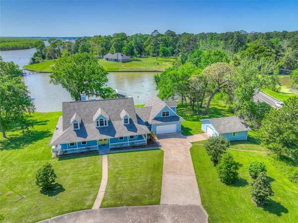a view of a lake with a yard