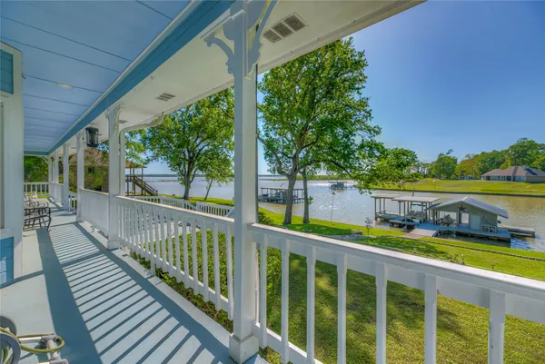 a view of a balcony with wooden floor and outdoor space