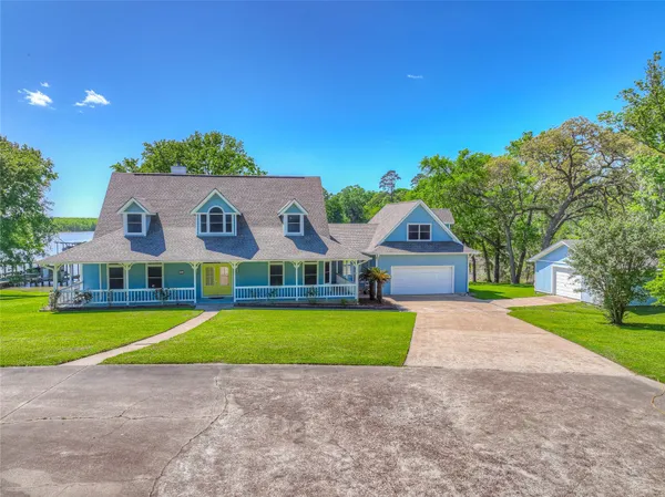 a house with swimming pool in front of it