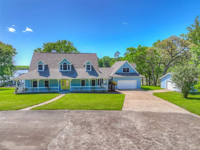 a house with swimming pool in front of it