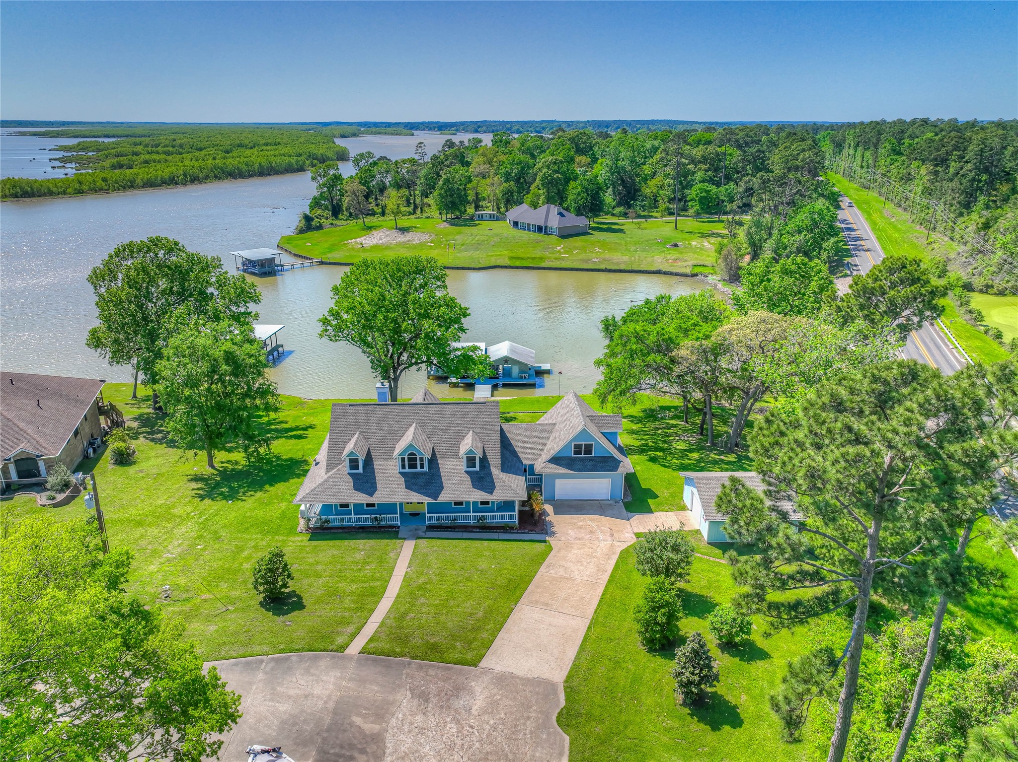 331 Memphis Belle Trinity, TX 75862 - Photo 45 of 50 an aerial view of a house with a garden and lake view