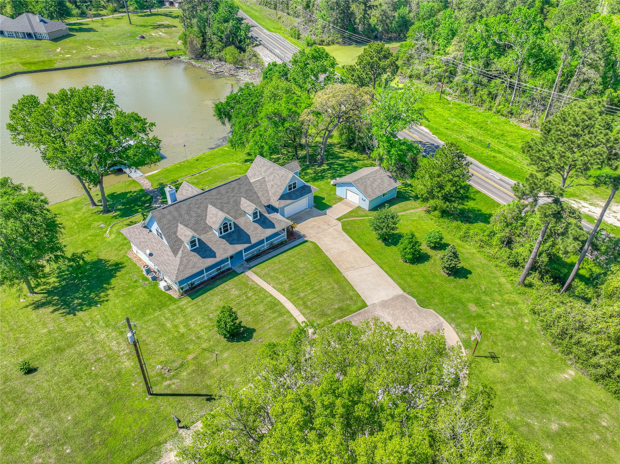 331 Memphis Belle Trinity, TX 75862 - Photo 46 of 50 an aerial view of a house with a yard and lake view