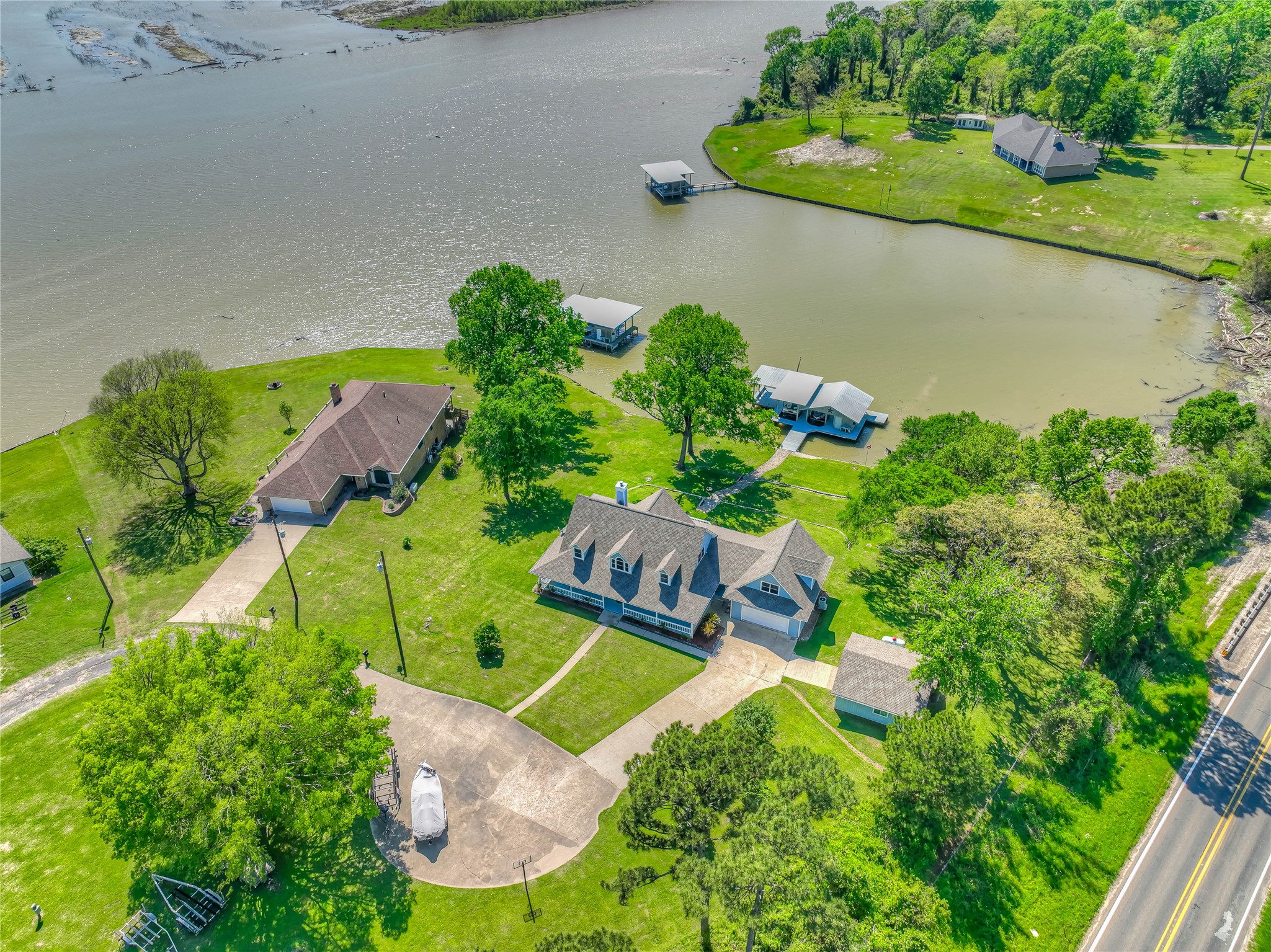 331 Memphis Belle Trinity, TX 75862 - Photo 47 of 50 an aerial view of a house with a yard and lake view