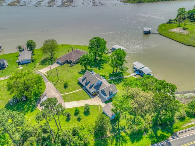 an aerial view of residential house with outdoor space