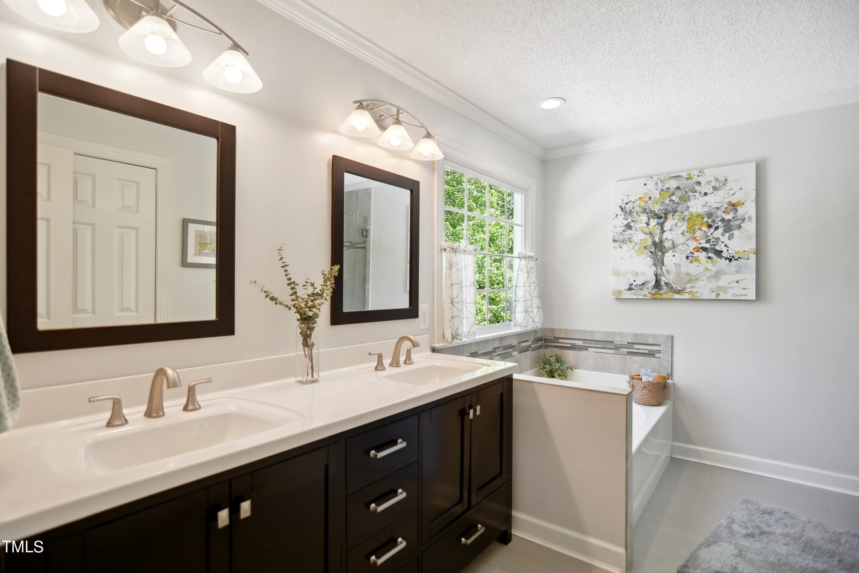 300 Foley Drive Garner, NC 27529 - Photo 16 of 29 a bathroom with a double vanity sink and a mirror