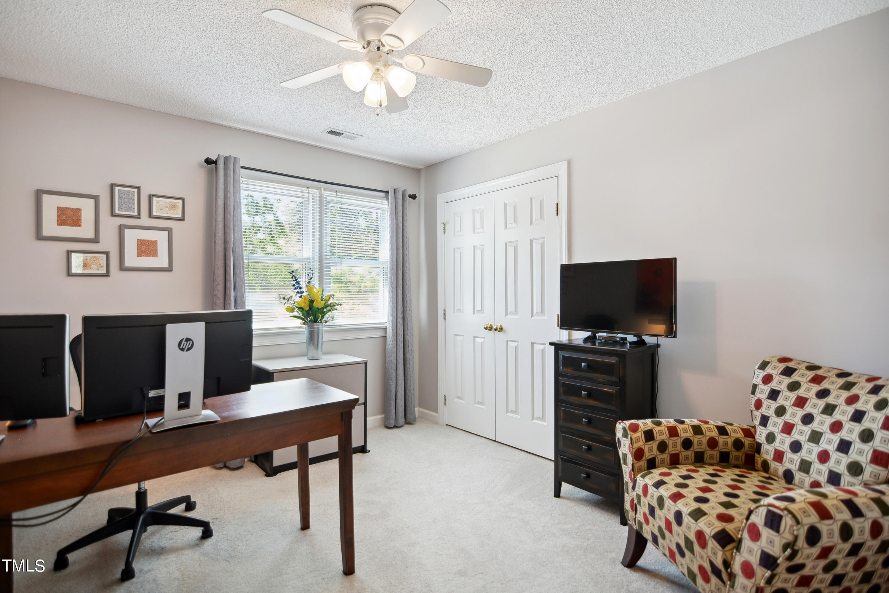 300 Foley Drive Garner, NC 27529 - Photo 20 of 29 a living room with furniture and a flat screen tv