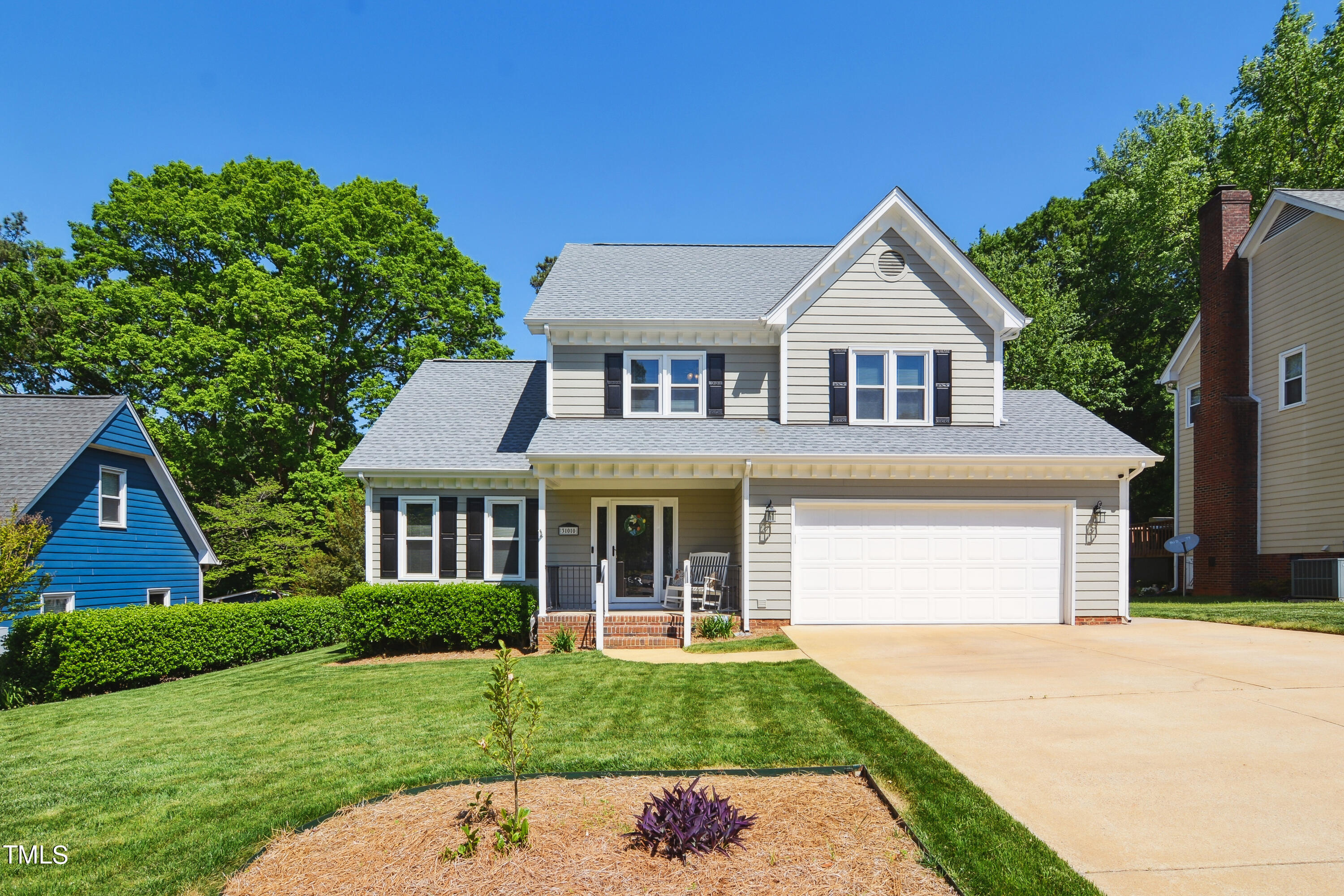 300 Foley Drive Garner, NC 27529 - Photo 2 of 29 a front view of a house with a yard and garage