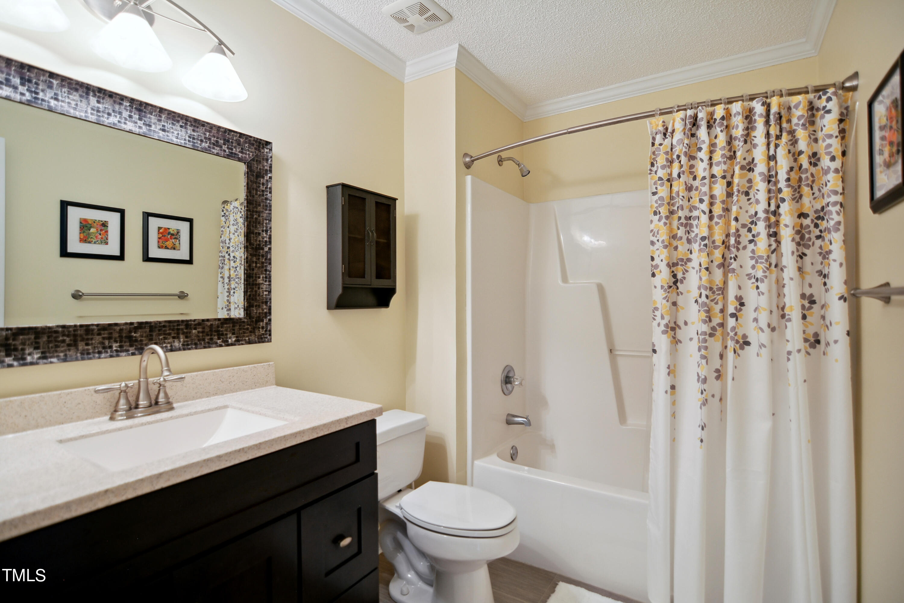 300 Foley Drive Garner, NC 27529 - Photo 21 of 29 a bathroom with a sink toilet a mirror a vanity and shower