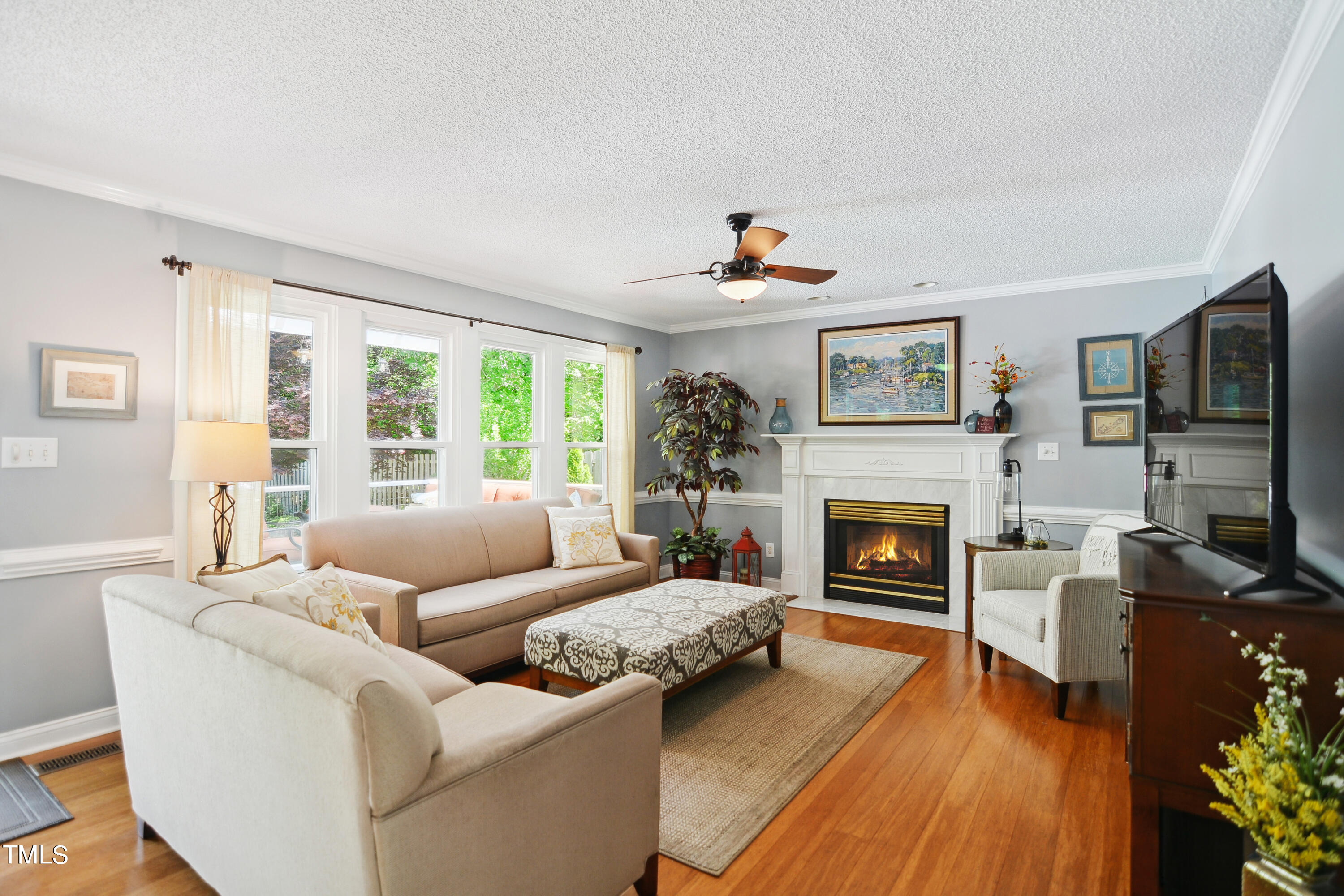 300 Foley Drive Garner, NC 27529 - Photo 8 of 29 a living room with furniture flat screen tv and a fireplace
